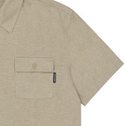 Beige short-sleeve shirt with a pocket on a white background