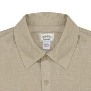 Beige shirt with a collar and 'Happy Sunshine' label on a white background