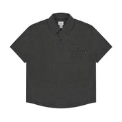 Charcoal polo shirt with a pocket on a white background