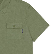 Khaki Green shirt with a pocket and a small label on a white background
