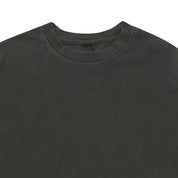 Close-up of a dark grey t-shirt with a plain background