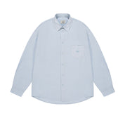 Light blue button-up shirt on a white background