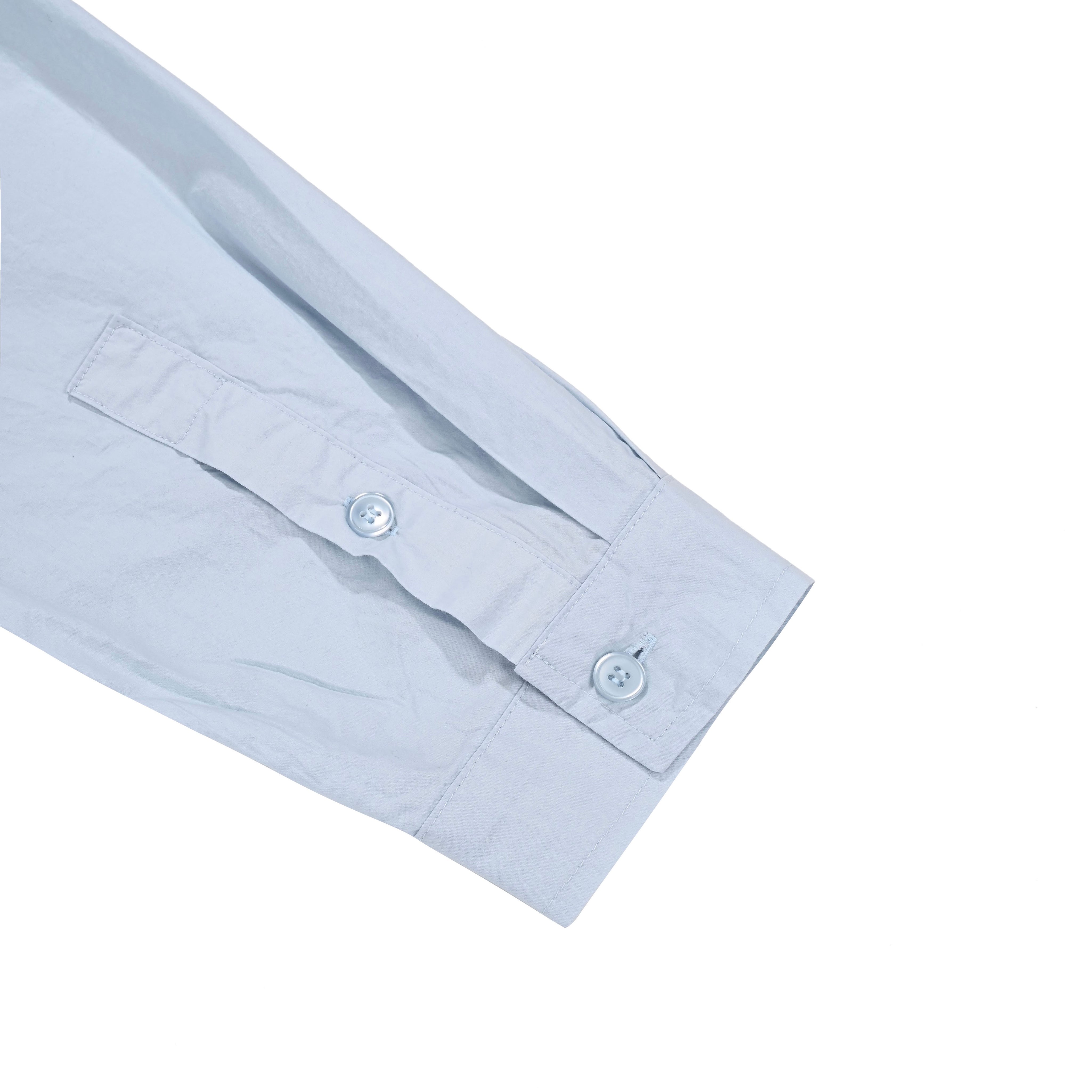 Light blue shirt  sleeve and cuff with 2 buttons on a white background