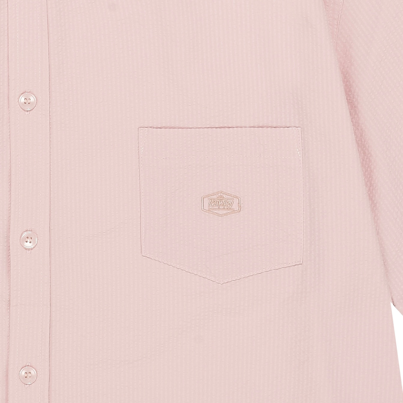 Close-up of a light pink shirt pocket with kappy brand logo on 