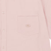 Close-up of a light pink shirt pocket with kappy brand logo on 