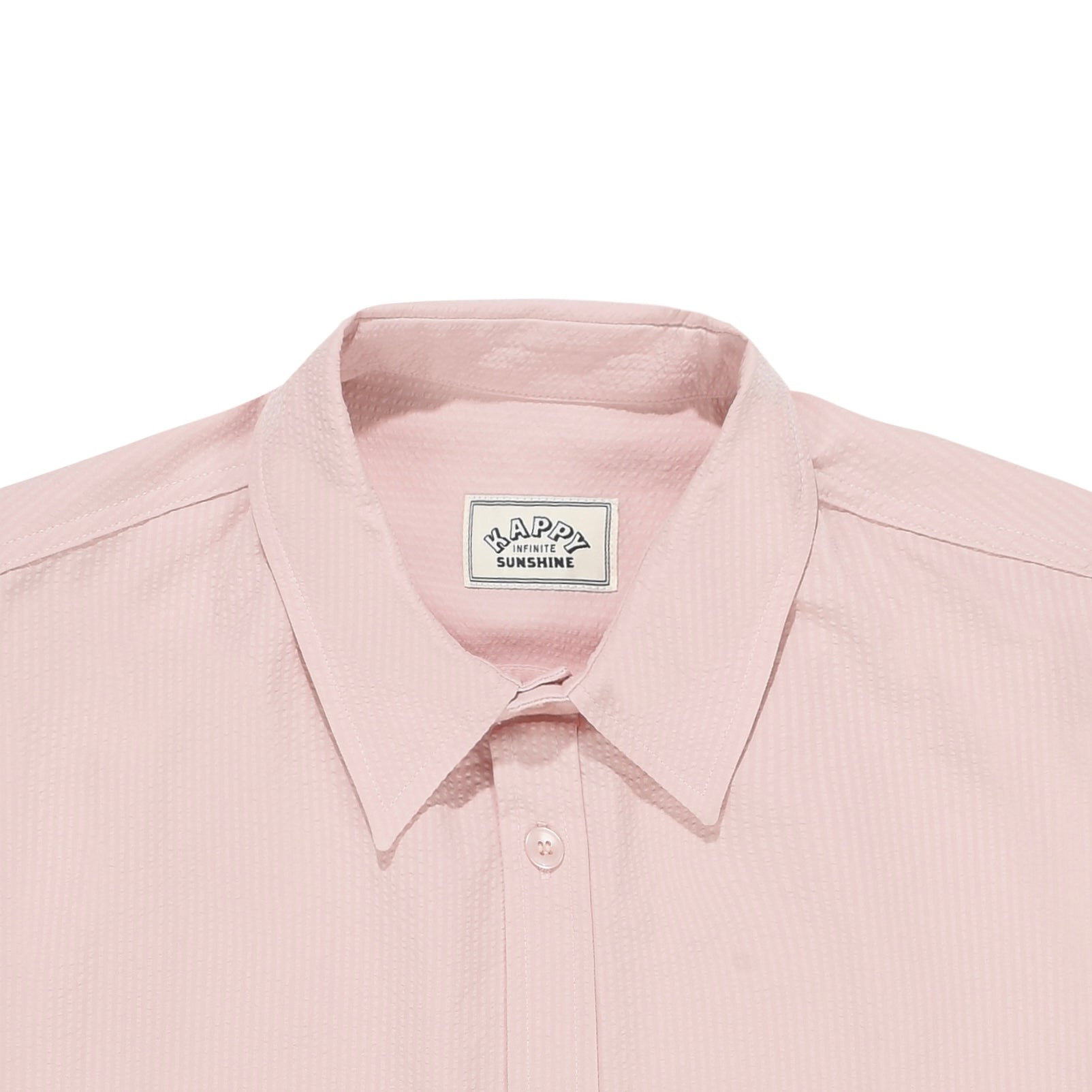 close up of Pink shirt collar with a visible brand label on a white background