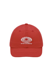 Red cap with a white "Infinite Sunshine" embroidery on the front