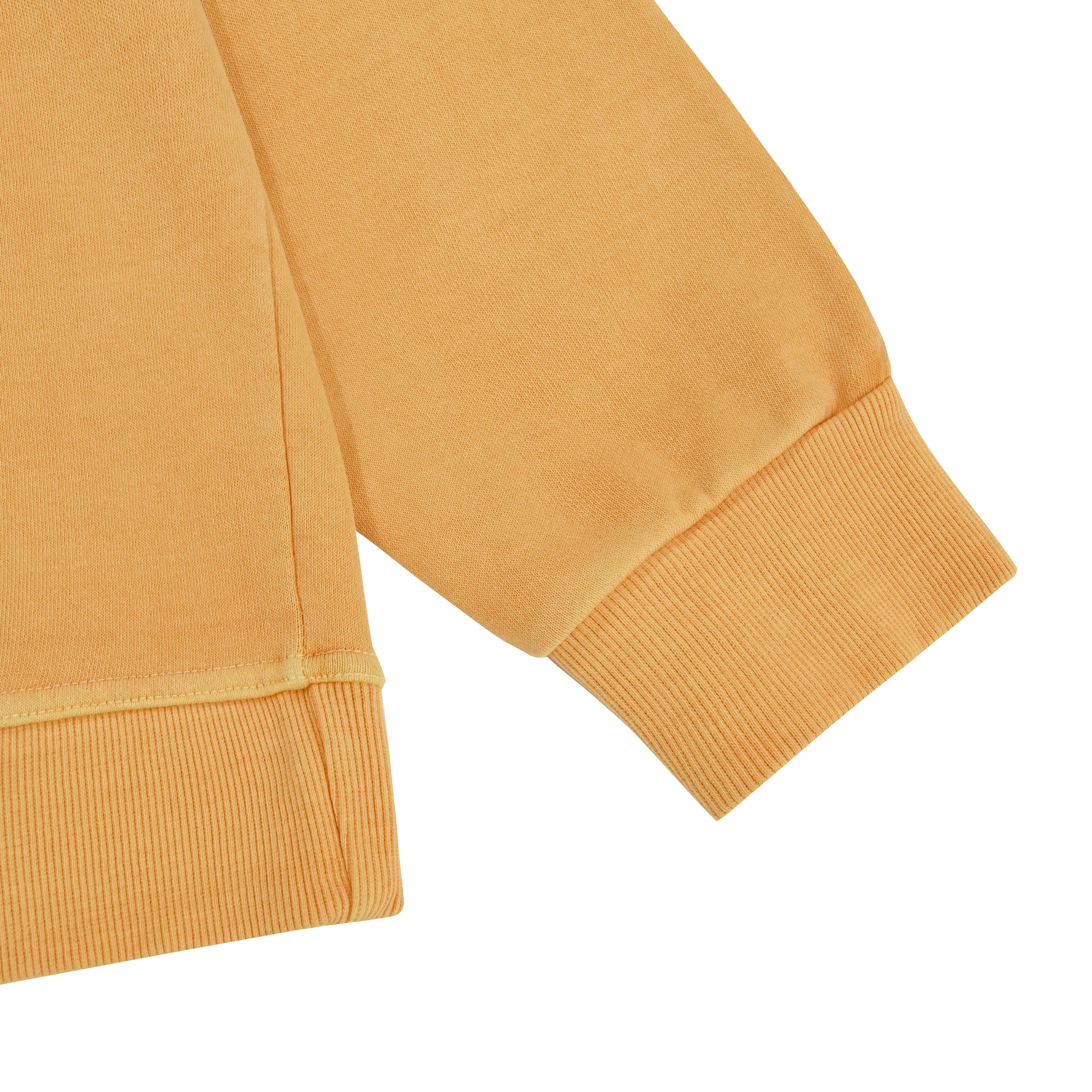 ribbed sleeve and waist band of orange sweatshirt