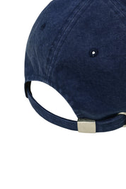 Navy blue cap with a metallic clasp on a white background