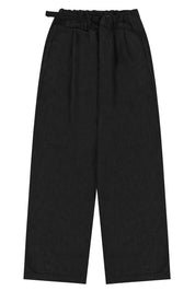 Black denim pants with a belt on a white background
