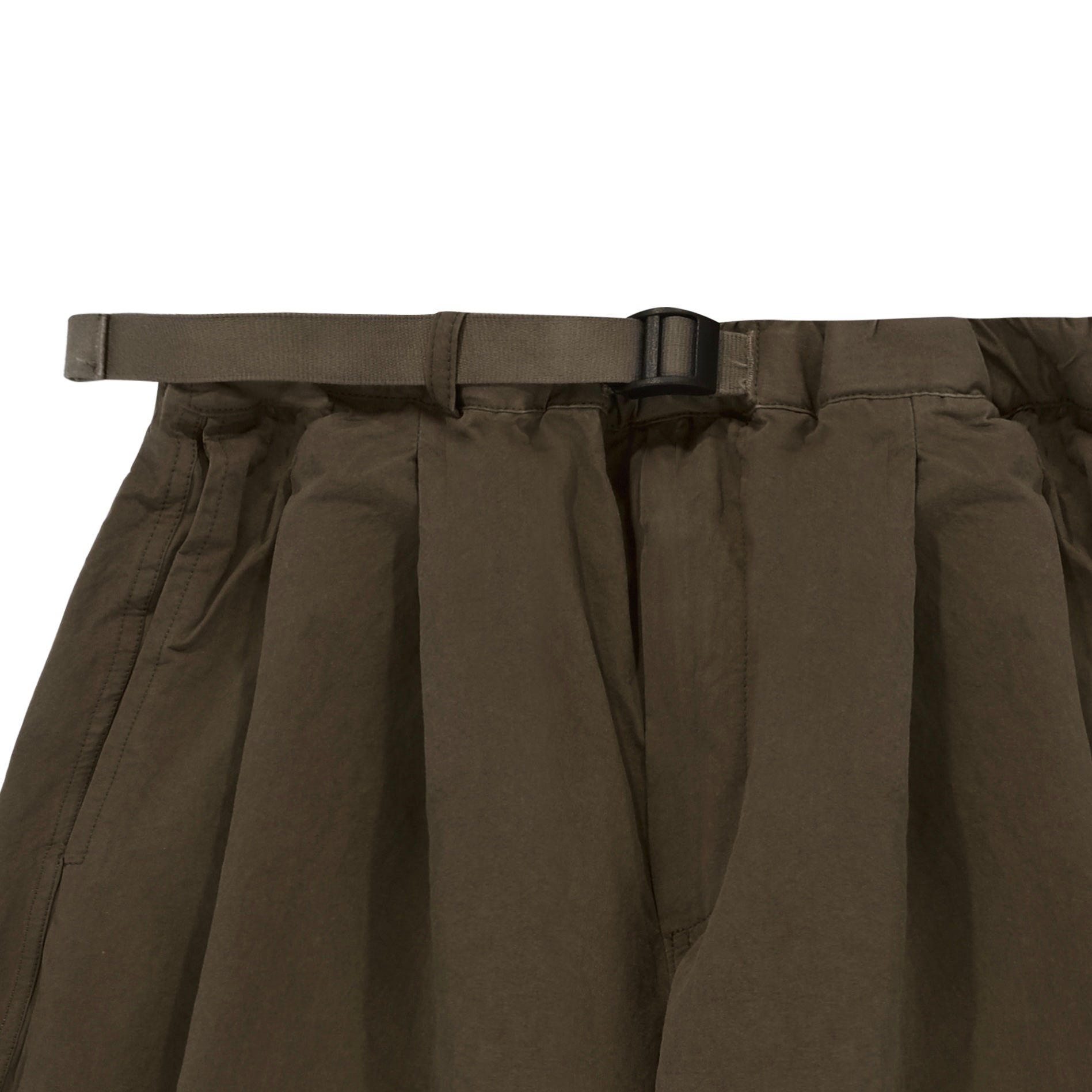 close up of Brown pleated waistband of trouser with a belt on a white background