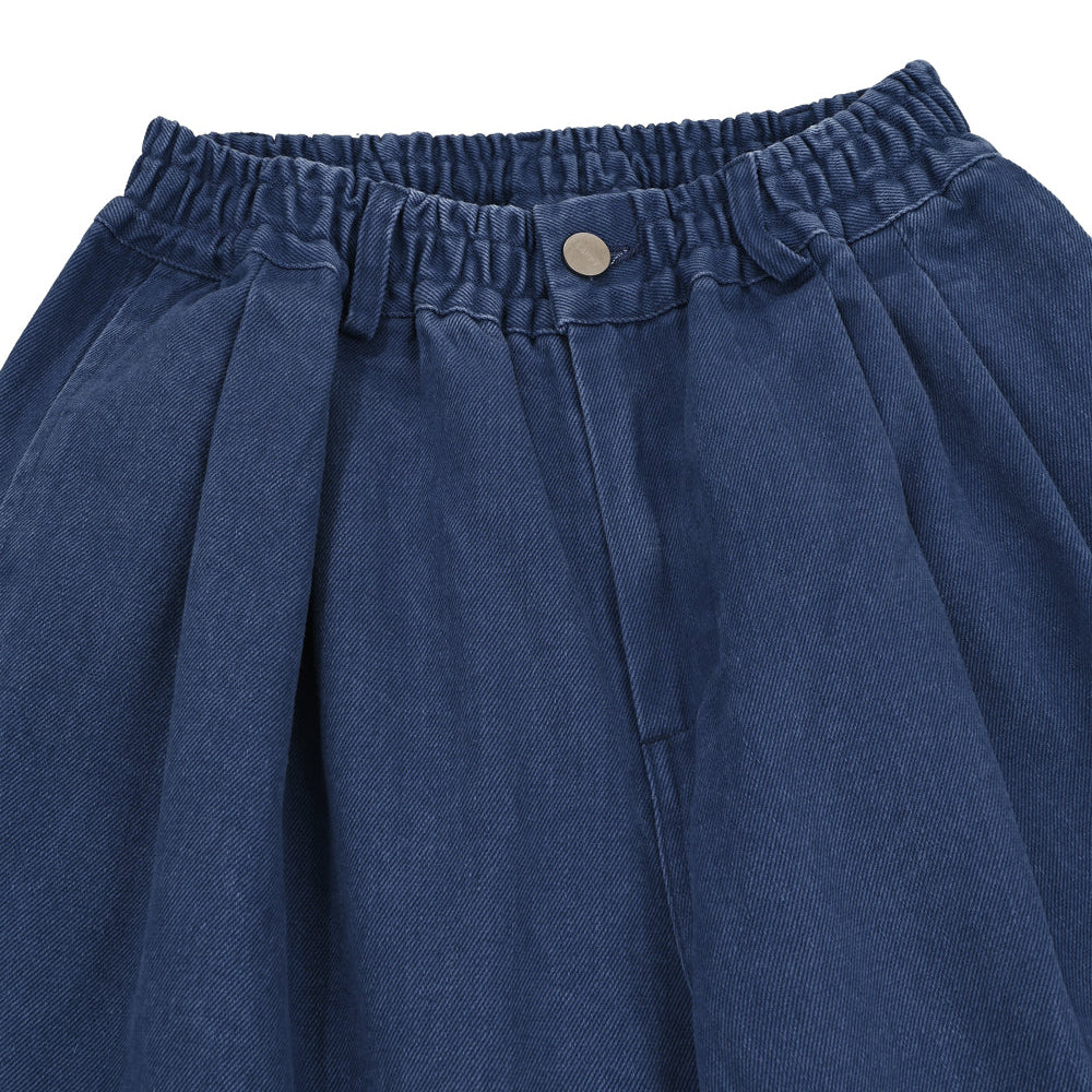 Blue denim skirt with an elastic waistband on a white background