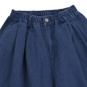 Blue denim skirt with an elastic waistband on a white background
