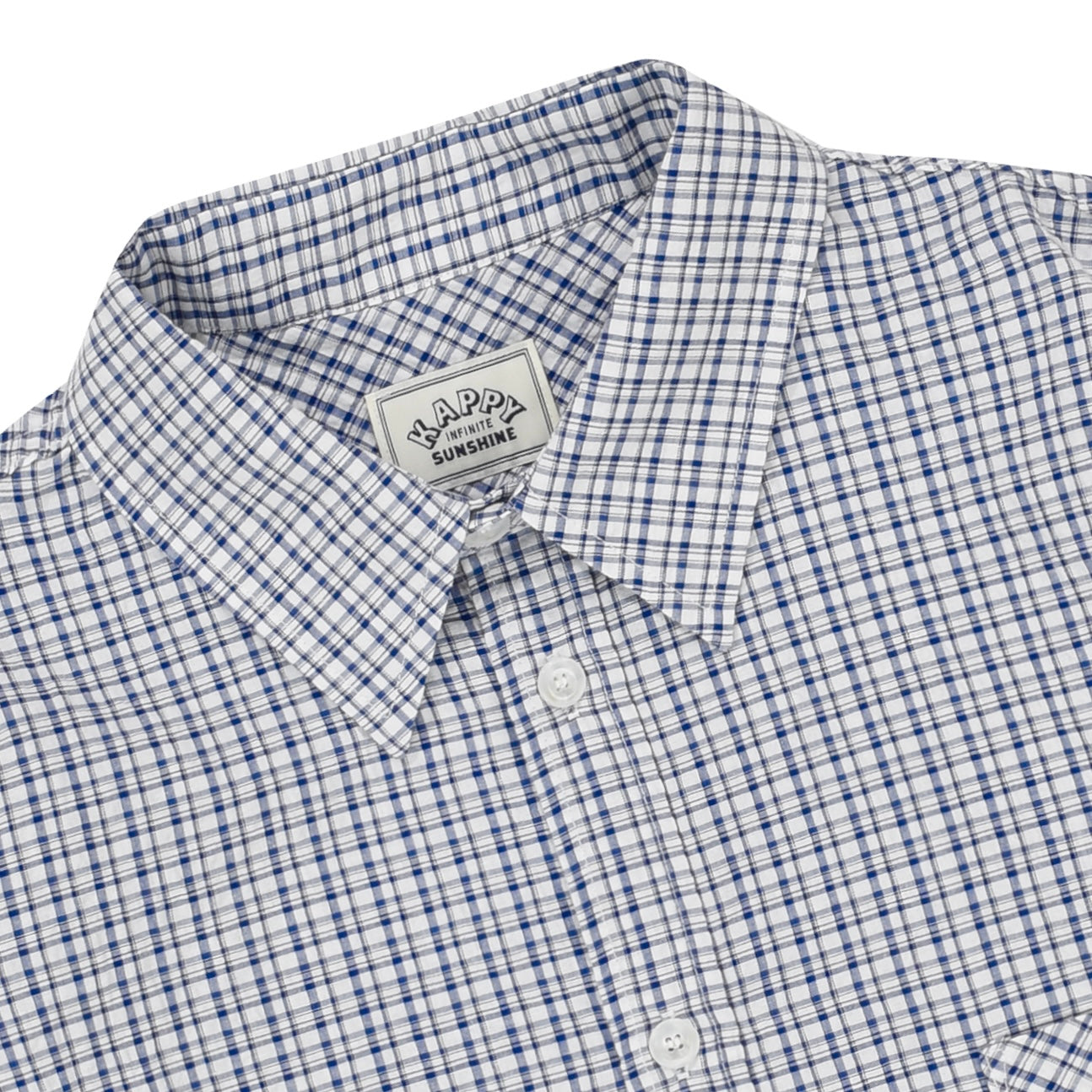 Long sleeve white and blue  checkered shirt with a visible brand label on a white background