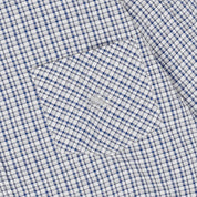 Close-up of a blue and white checkered shirt with a pocket.