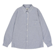 Long sleeve white and blue checkered shirt with a pocket on a white background